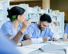 Hình ảnh về diverse group of nursing students studying together in a library or common area